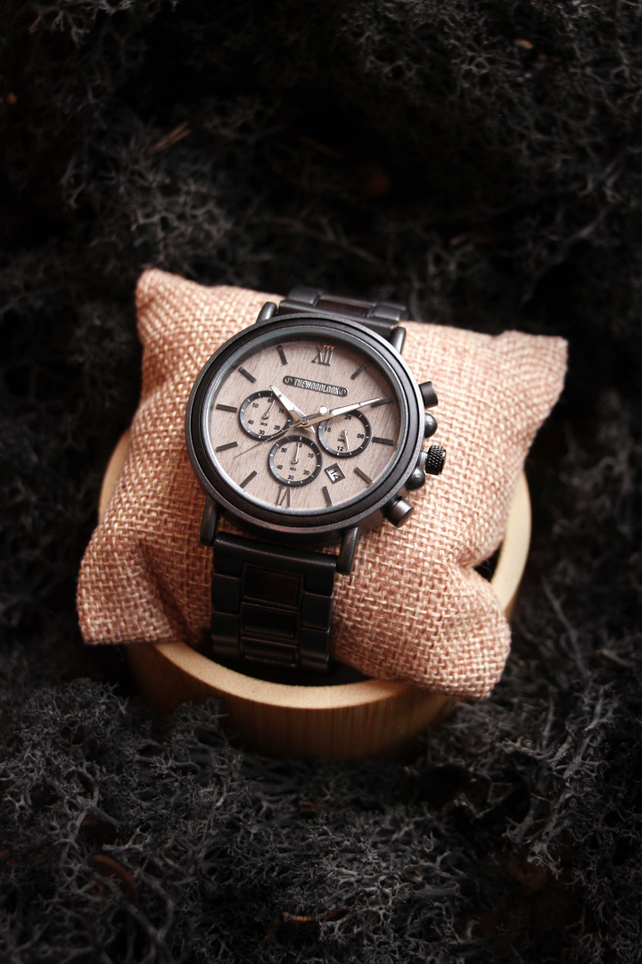 Austin gunmetal steel and ebony watch on a cushion and wooden stand - The Wood Look