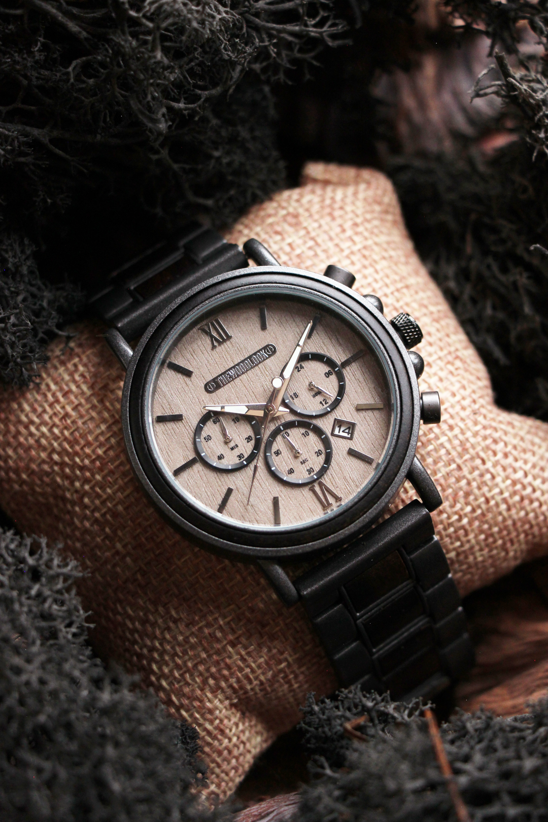Austin gunmetal steel and ebony chronograph watch on a watch cushion - The Wood Look