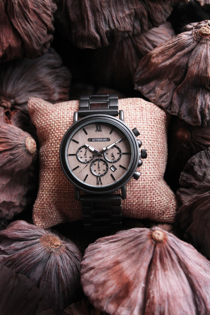 Austin gunmetal and ebony chronograph watch on a cushion with dried flowers - The Wood Look