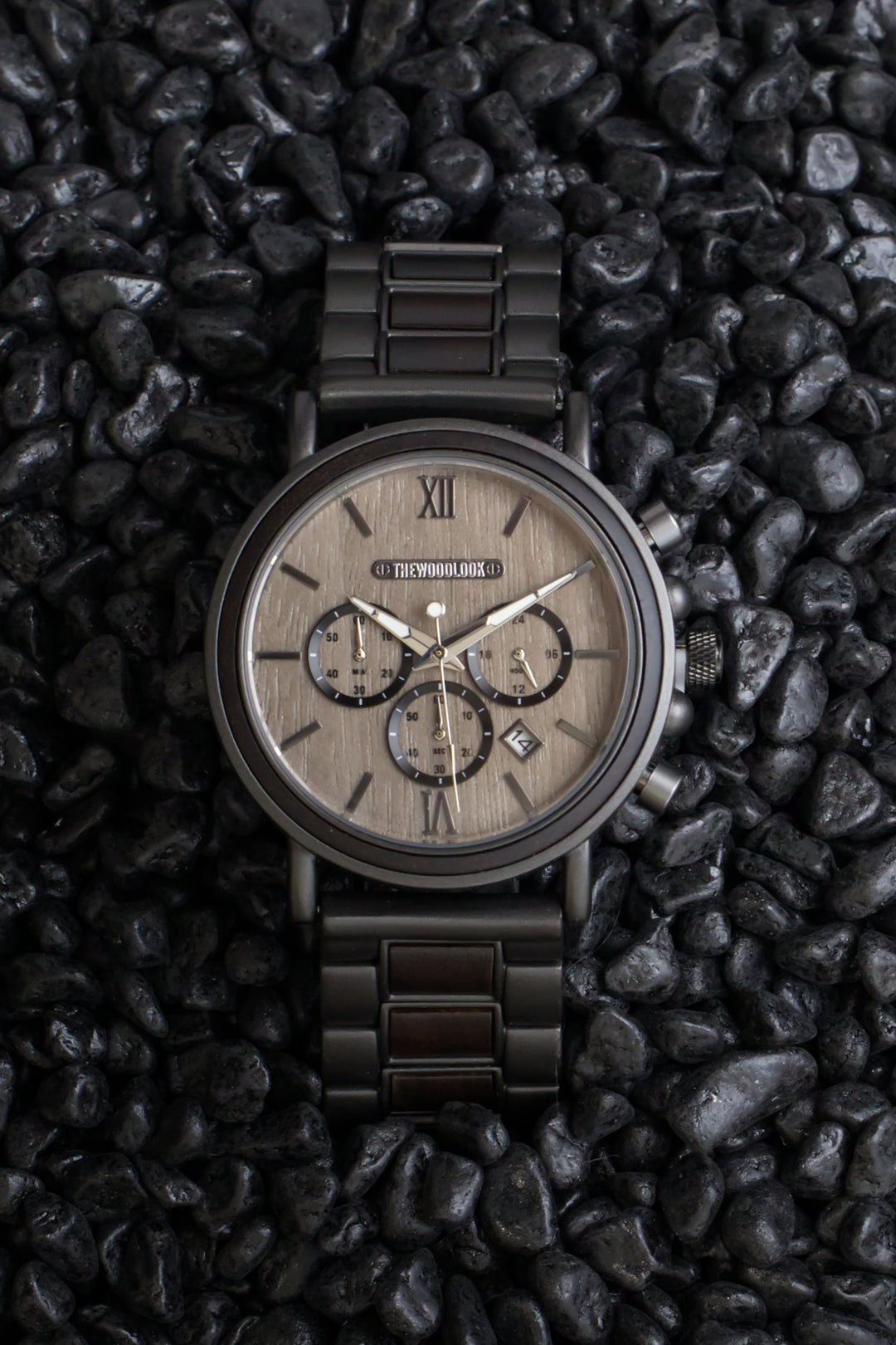 Austin gunmetal and ebony chronograph watch on black stones - The Wood Look