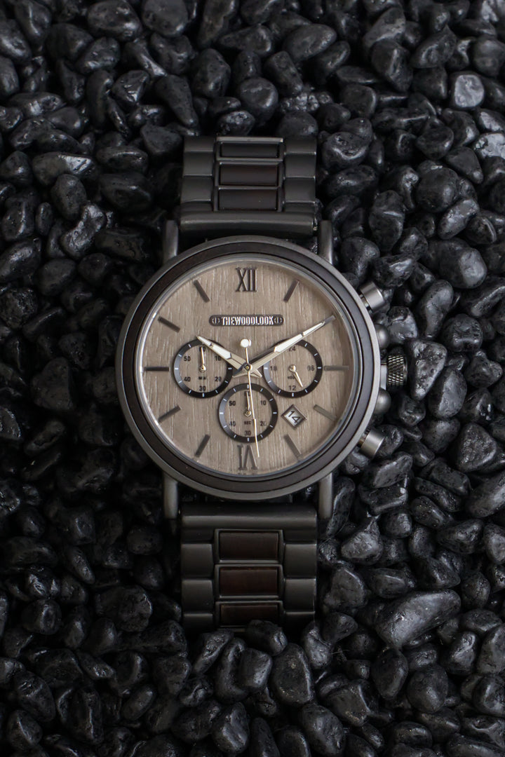 Austin gunmetal and ebony chronograph watch on black stones - The Wood Look