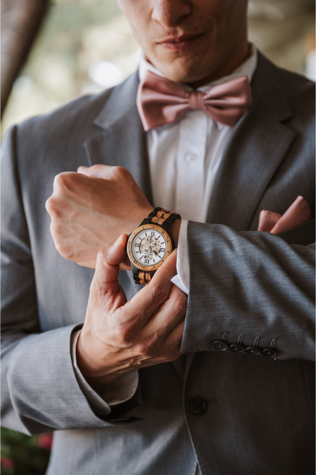 Groom in a grey wedding suit wearing the Barcelona white dial mechanical wooden watch - The Wood Look