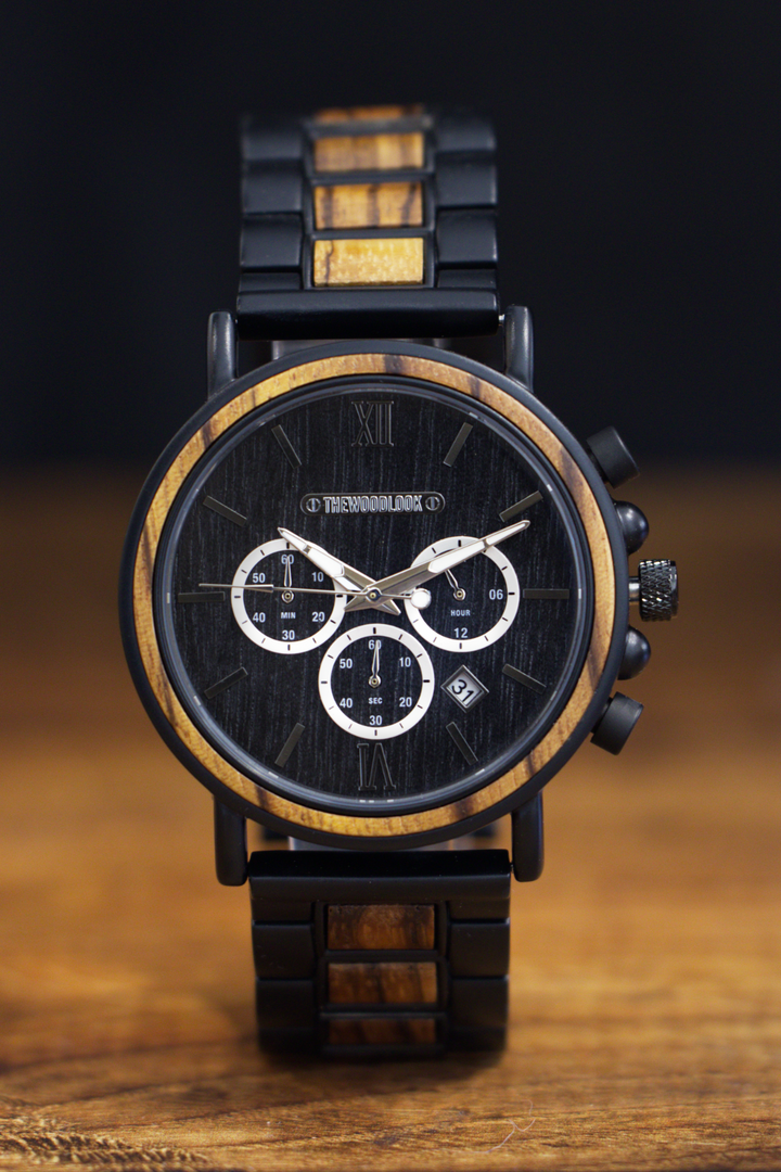 Boston black and zebrawood chronograph watch standing on a wooden table - The Wood Look