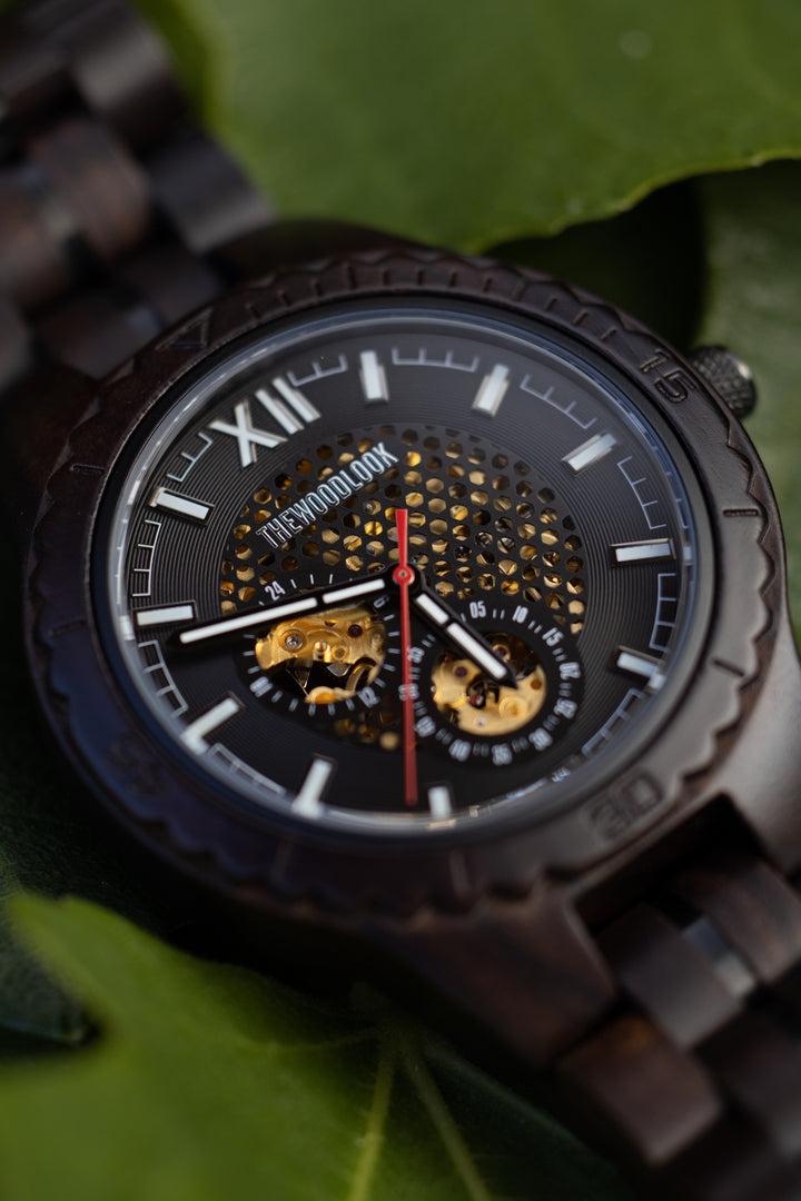 Close-up of the Detroit dial with Roman numerals, gold-tone movement and red seconds hand - The Wood Look