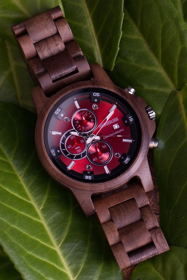 Edinburgh walnut wooden watch with a red chronograph dial on a green leaf - The Wood Look
