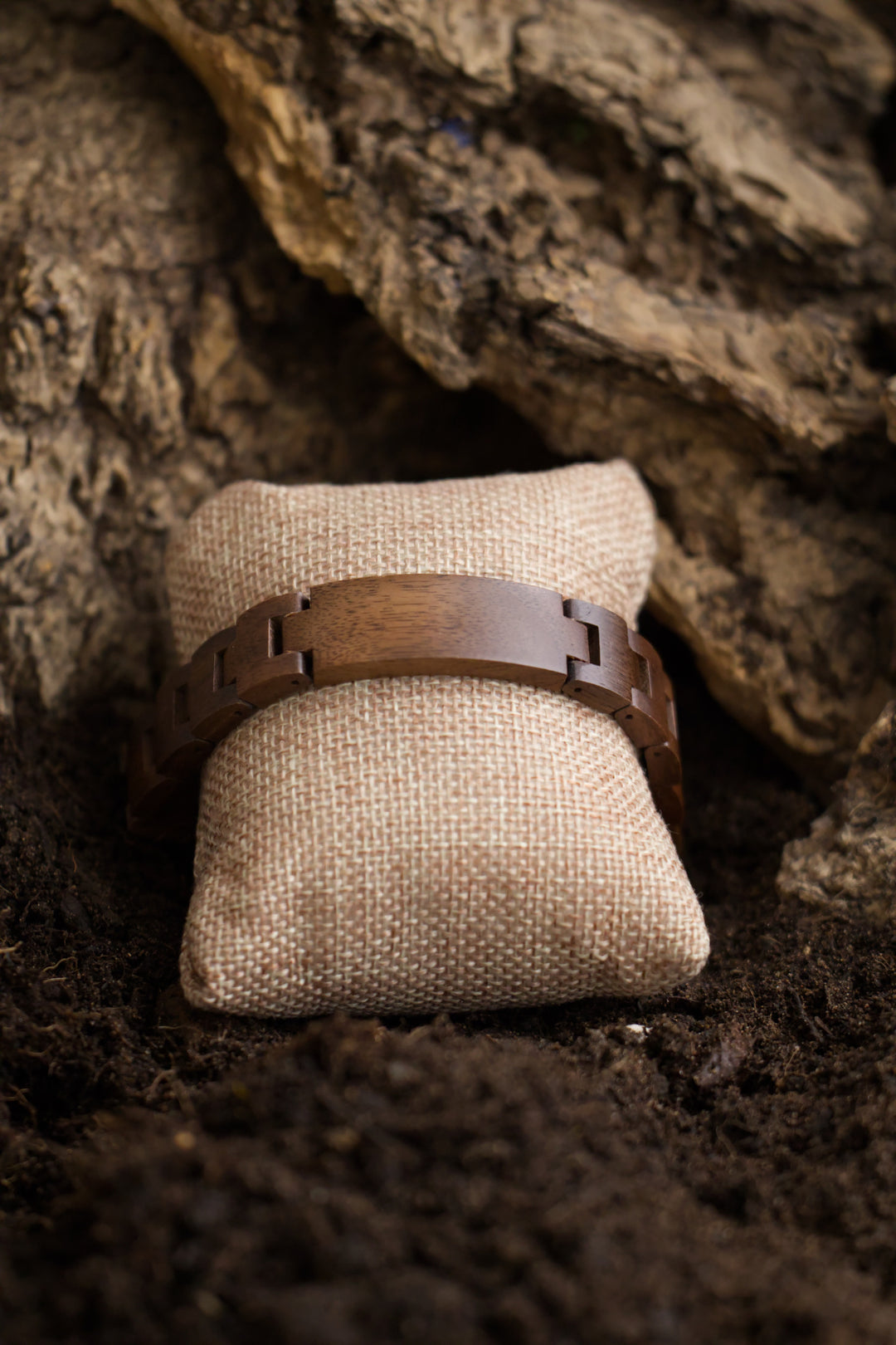 Juglans walnut wooden bracelet on a hessian cushion - The Wood Look