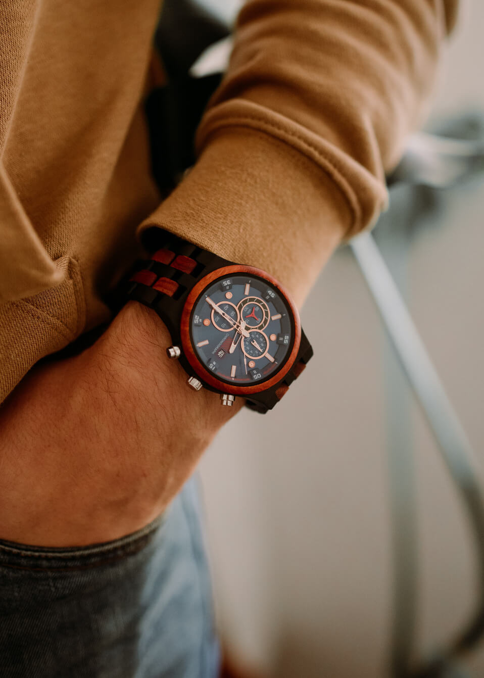 Man wearing the Lisbon sandalwood and ebony wooden watch with a mustard jumper - The Wood Look