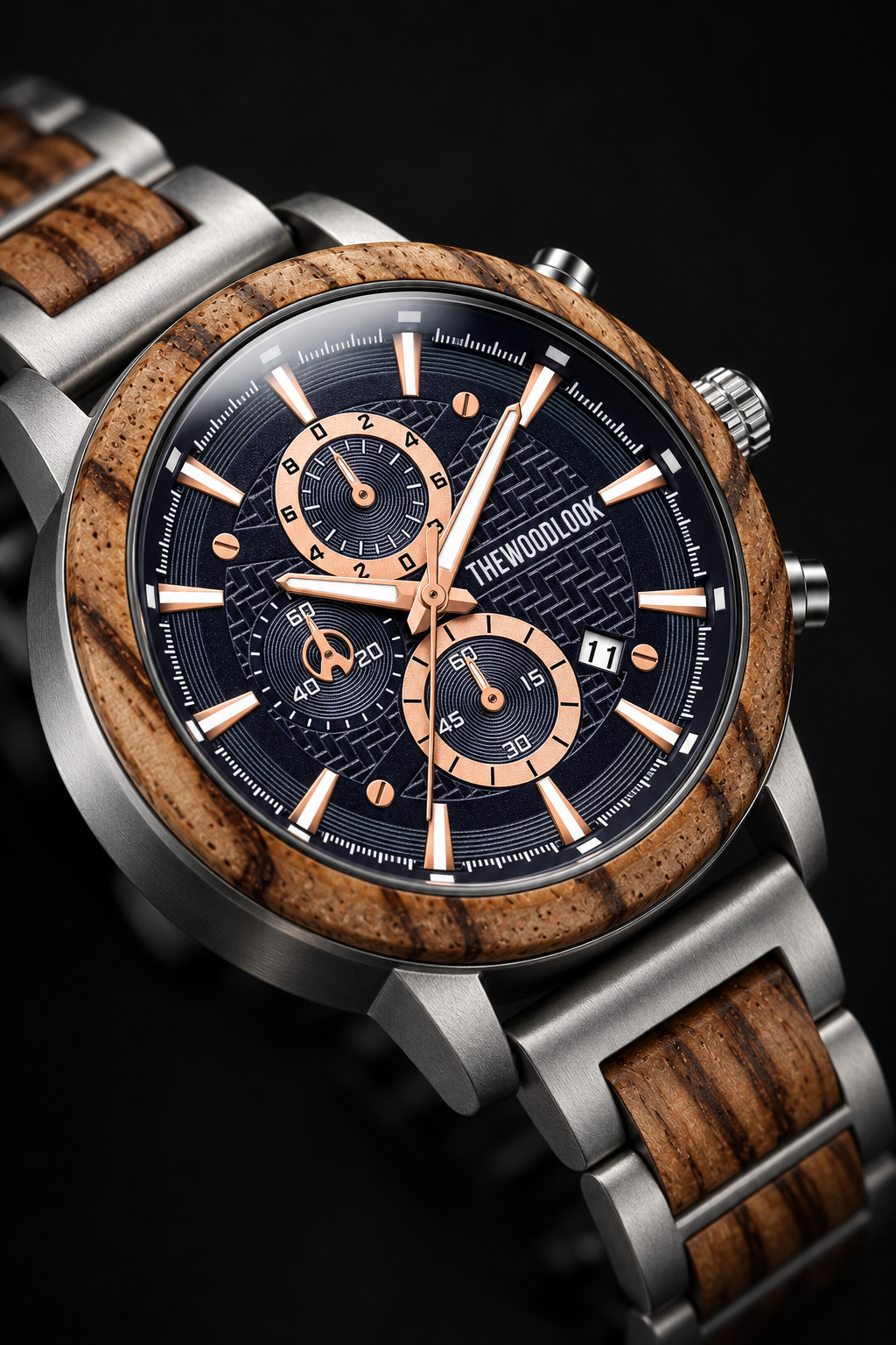 Close-up of the London zebrawood bezel and navy chronograph dial with rose gold hands