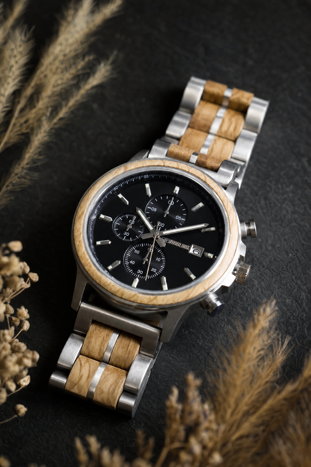 Oslo oak chronograph wood watch on dark slate with dried grasses - The Wood Look