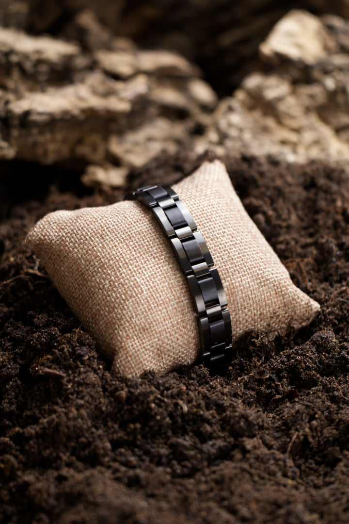 Reykjavik ebony and gunmetal steel bracelet on a hessian cushion - The Wood Look