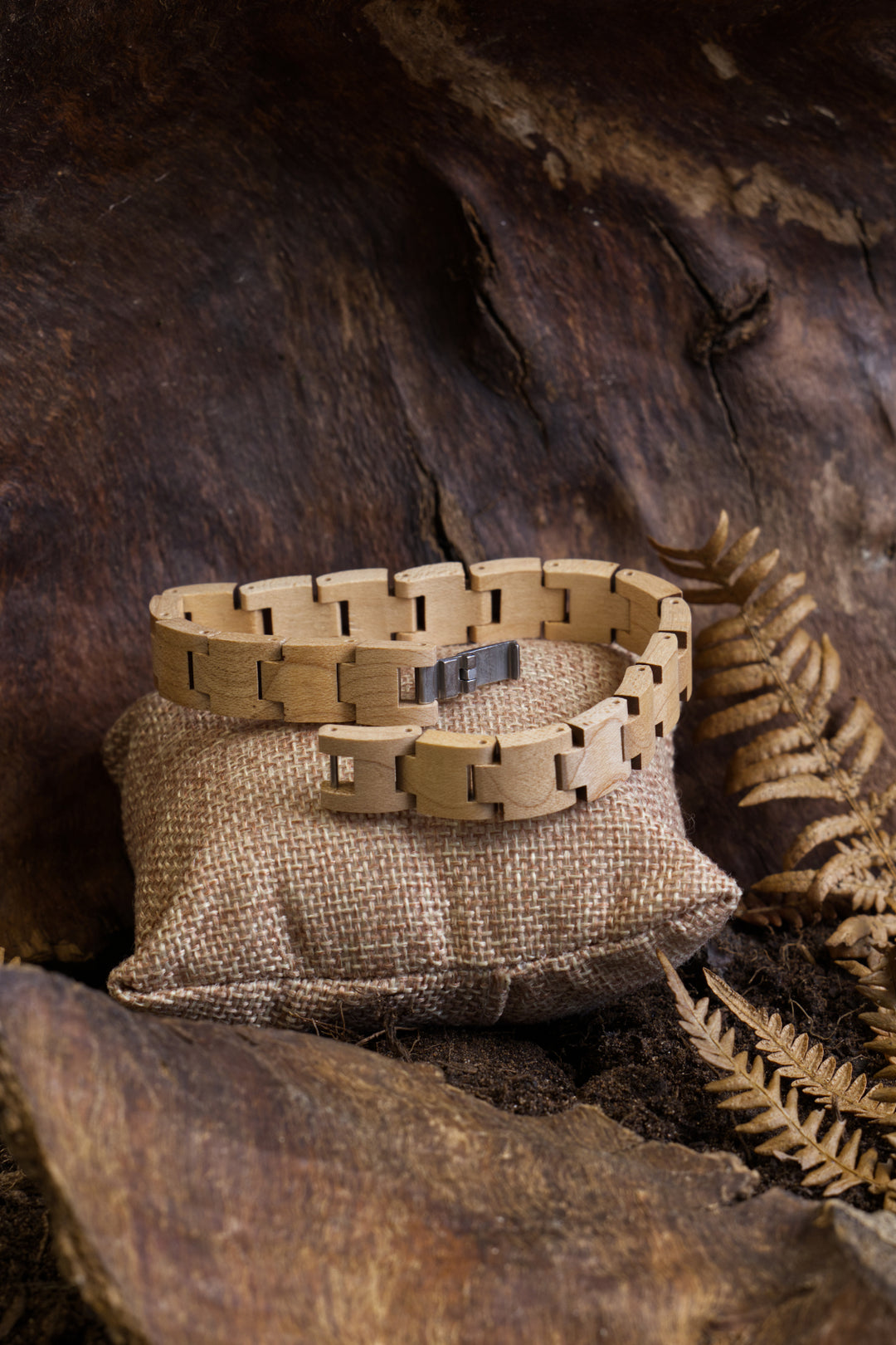Vancouver maple wooden bracelet on a cushion among ferns - The Wood Look