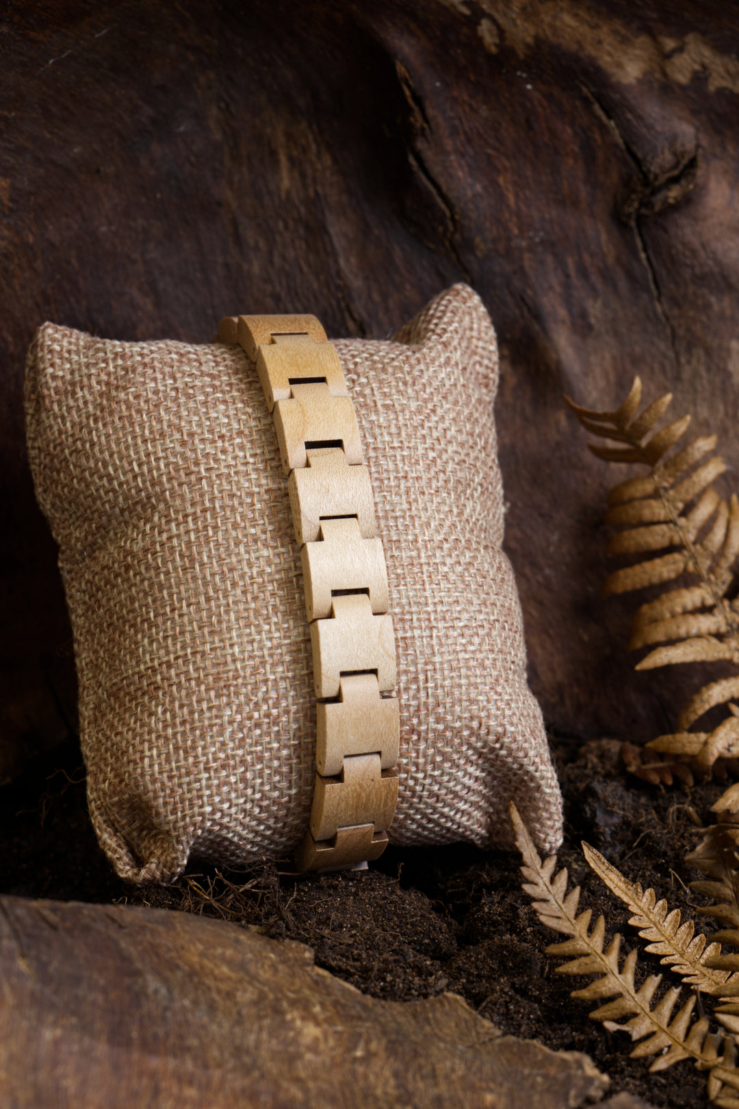 Vancouver light maple wooden bracelet on a cushion with dried ferns - The Wood Look