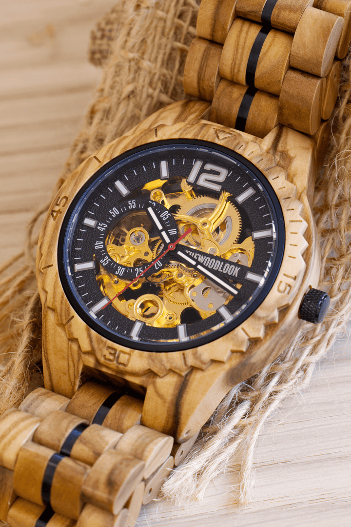 Close-up of the Venice olive wood watch showing the gold-tone automatic movement - The Wood Look