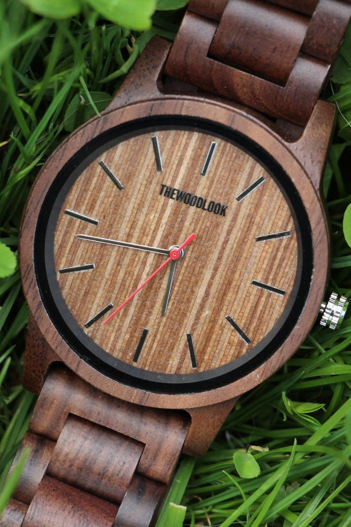Close-up of the Warsaw wooden dial with black markers and a red seconds hand - The Wood Look