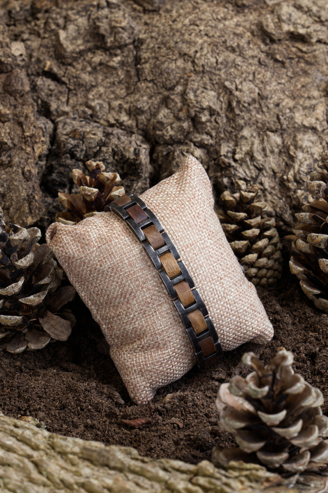 Yukon walnut and antique steel bracelet on a hessian cushion - The Wood Look